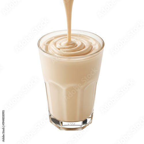 A glass of creamy milkshake with a stream of liquid pouring into it