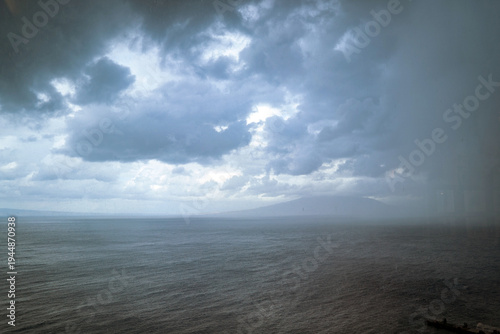 Fotografija Vesuvius Volcano seen from Sorrento, Italy: Stormy sea and sky with distant land