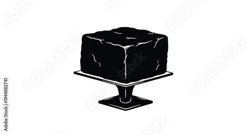 black cake on a pedestal plate dessert