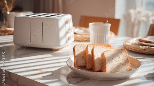 Kitchen table holds a white toaster and a plate with bread slices.