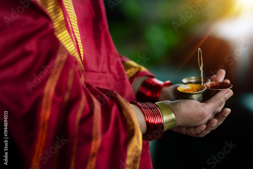 Woman's hands holding kukum and turmeric 