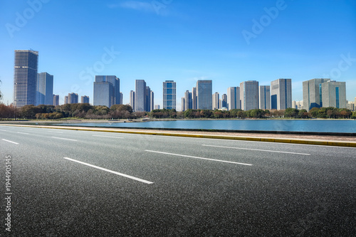 Modern City Skyline with Clear Blue Sky and Serene Waterfront