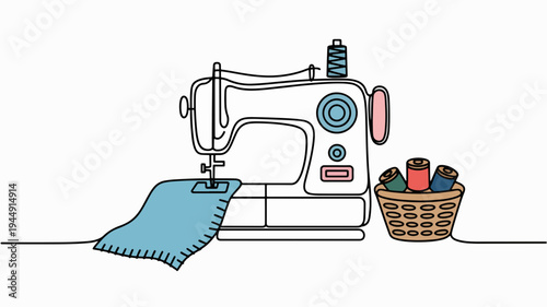 Sewing machine with blue fabric and basket of colorful threads on table for textile crafting and diy projects at home