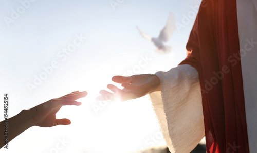 Schilderij op canvas The hand of Jesus Christ, who holds the hand of a sinner, offering forgiveness and salvation, and the concept of faith and hope for heaven
