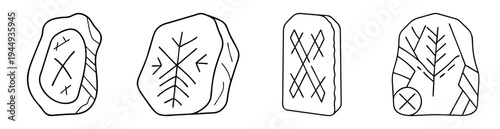 Four carved stones with different runic symbols for divination or fortune telling
