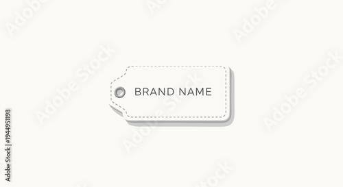 A light grey rectangular tag with rounded corners, a dashed outline, a metal eyelet, and BRAND NAME text casts a subtle shadow.