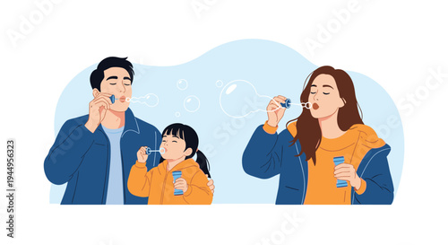 Happy young parents and their daughter having fun blowing soap bubbles together outdoors in a park on a sunny summer day.
