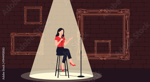 Female stand-up comedian performing on a stage under a bright spotlight in a club with empty picture frames on a brick wall background.