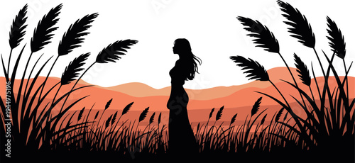 Silhouette of woman standing in tall grass with desert hills backdrop sunset light and pampas grass