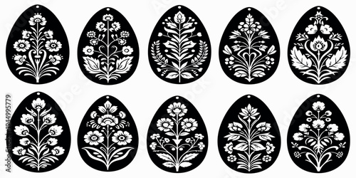 Eight black and white teardrop shaped floral designs