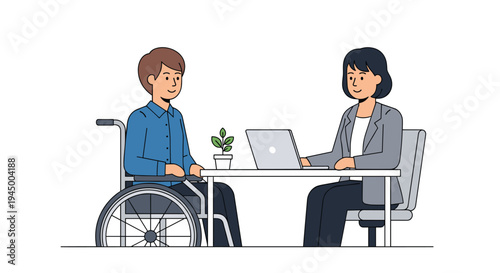 A man in a wheelchair converses with a woman working on a laptop at a white desk, a small plant between them.