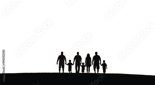 Silhouette of a blended family walking hand in hand at sunset