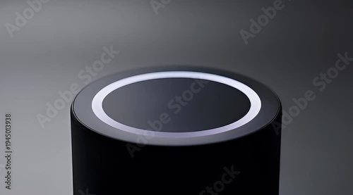 Close up of a sleek black cylinder with a luminous white ring