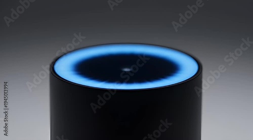 Close up of a smart speaker with a glowing blue light ring