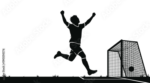 Silhouette of a soccer player celebrating after scoring a goal