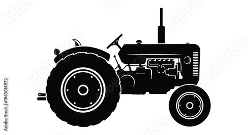 Black and white silhouette of a vintage farm tractor side view