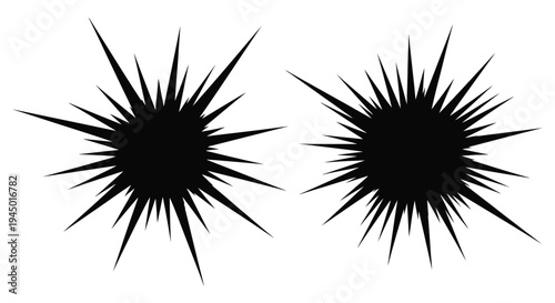 Two black starburst shapes with sharp radiating spikes against a white background
