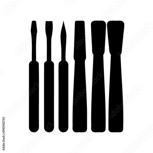 Set of various black hand tool silhouettes, including screwdrivers and chisels, against a white background Vector, illustration