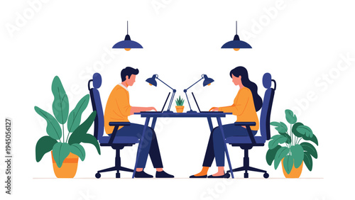 Two colleagues working together on laptops at a shared office desk in a modern and clean professional environment.