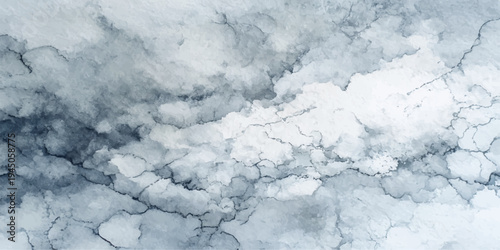 A stunning abstract texture of frozen blue ice on the river captured outdoors on a cold winter day beneath a bright sky with fluffy white clouds