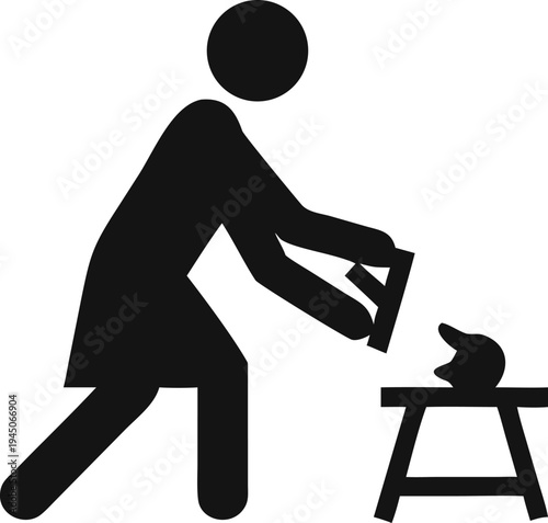 Skilled craftsperson diligently shaping materials on a dedicated workstation using specialized hand tools