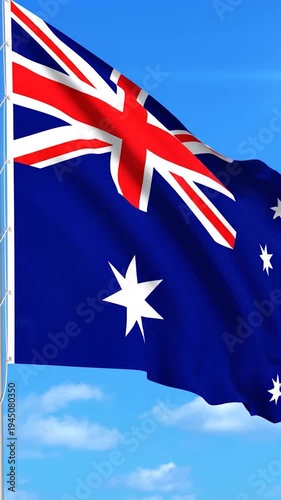 A national flag waves proudly against a clear blue sky