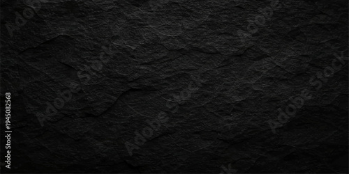 A dark grunge leather material with a rough black and white stone texture creates a weathered macro surface pattern for an old fabric wallpaper design