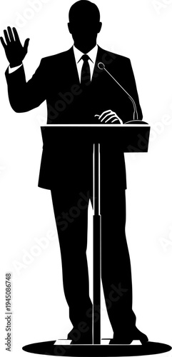 Silhouette of a man in a suit speaking at a podium