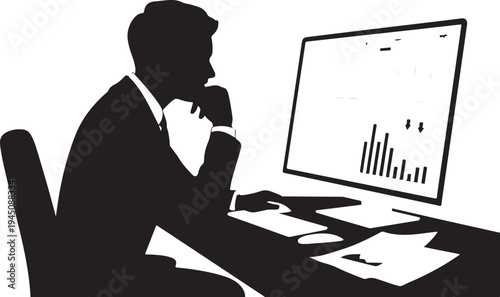 Man in suit sitting at desk looking at computer screen with bar graph