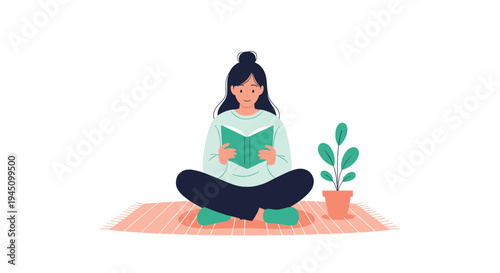 Young woman sitting cross legged on a striped rug while reading a green book in a peaceful home environment next to a small potted plant.