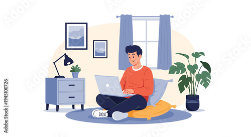 Young man sitting comfortably on floor cushions using a laptop in a cozy living room with plants and pictures.