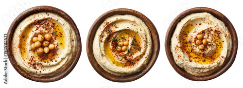 Set of Creamy hummus served in wooden bowl, topped with cucumber, herbs, sesame seeds, and olive oil, isolated on white background