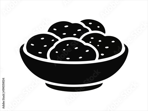 Bowl of round food items with speckles