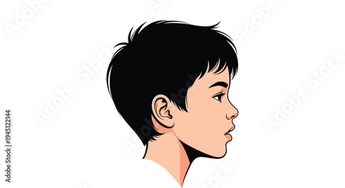 Profile view of a young boy with short black hair looking forward with a thoughtful expression on his face for portrait studies.