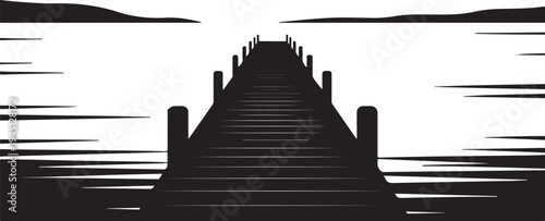 Black silhouette of a pier extending into a body of water