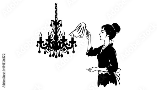 A maid cleaning a beautiful black chandelier with a cloth