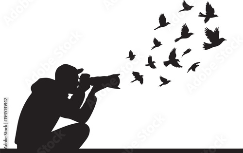 Silhouette of photographer taking of flying birds camera