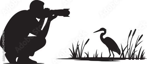 Silhouette of photographer taking of heron bird grass