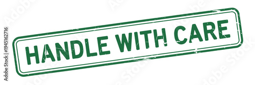 A green stamp displaying the text handle with care in bold lettering