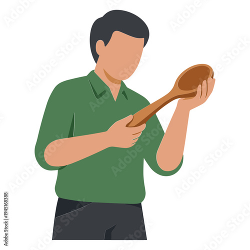 A man holds and examines a large wooden spoon in his hands.