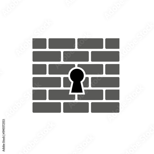 A keyhole in a brick wall.