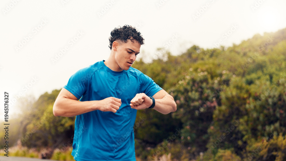 Fototapeta premium Runner, smart watch and check with man in nature for fitness tracker, performance app and health stats. Running progress, online training schedule and wellness with person outdoor for stopwatch timer