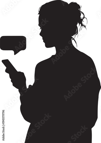 Silhouette of a woman engrossed in texting on her smartphone