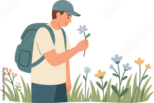 Man in a field examines a blue flower closely outdoors