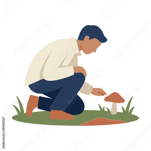 Man crouches down to examine a mushroom in the grass outside
