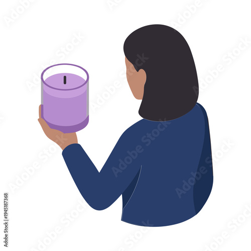Woman holds candle in hand from behind indoors with purple flame