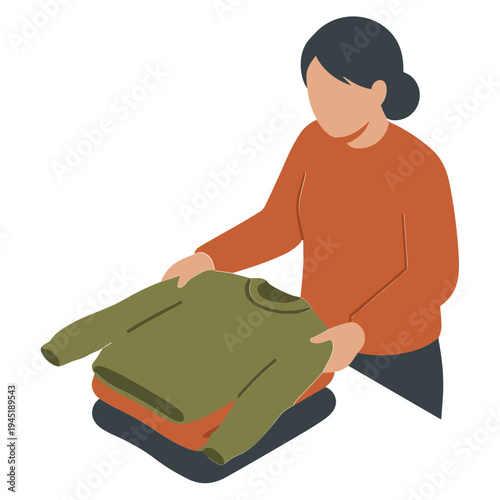 A woman stacks folded clothes on a pile