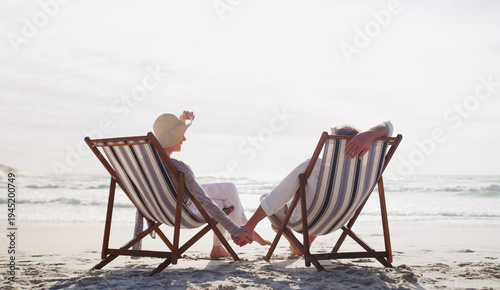 Cuadro en lienzo Old couple, relax and chairs at beach on vacation with bonding, love and connection in summer