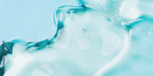 Transparent hyaluronic acid gel on a blue background.