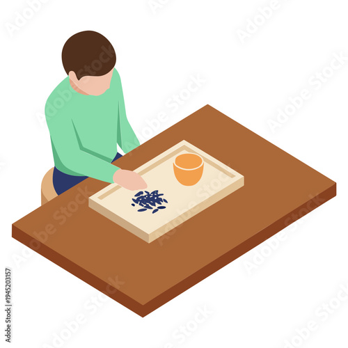 Man sitting at table preparing food with cutting board and cup